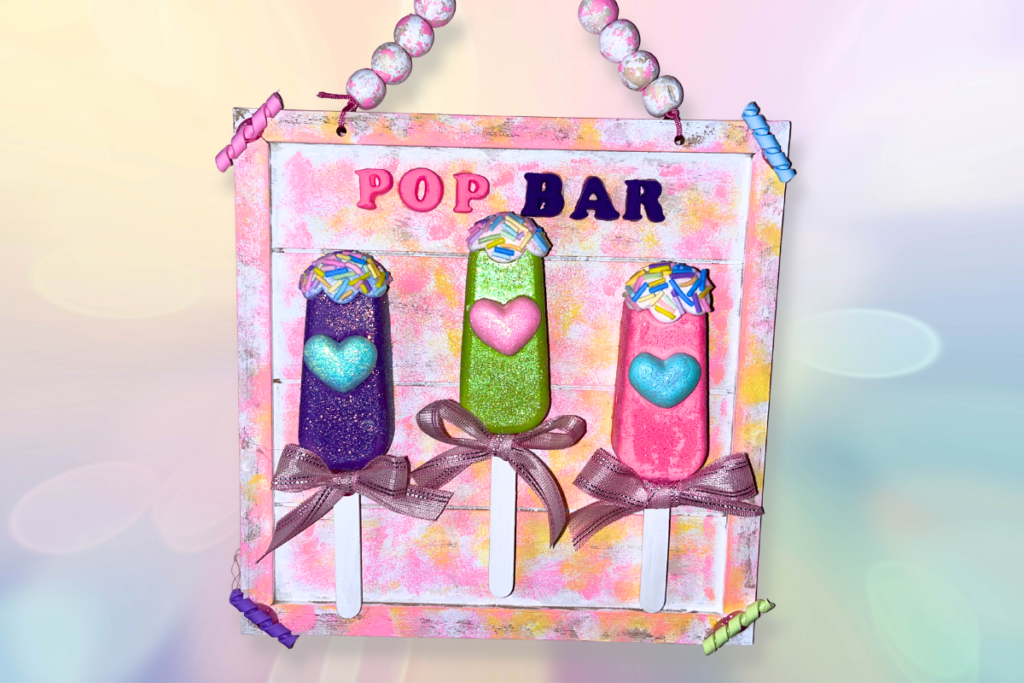 DIY Dollar Tree wall art with plaster of Paris decorations and foam clay lettering